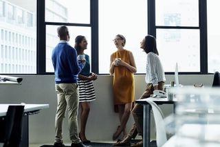 A group of employees stand together